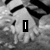 Black-and-white animated icon with a blurred background showing repeated patterns, displaying sequential text overlays.