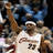 A split-screen icon shows a basketball player in a white jersey with number 23 on the left and a grayscale figure holding a baton on the right, below text reading "we are all WITNESSES" and a Nike logo.