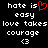 Black background with white pixelated text reading 'hate is easy love takes courage <3' and a red heart symbol replacing the word 'is' in the first line.