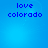 Blue background with pixelated text 'love colorado' in dark blue, arranged in two lines across four identical quadrants.