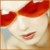 Pixelated close-up of a face with closed eyes, red hair or head covering, and visible lips against a light background.