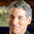 Static 50x50 pixel icon showing a close-up of an older man with gray hair and light skin, partially cropped on the right side against a blurred background.