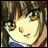 Anime-style character with brown hair and green eyes, wearing a blue and white top with red trim, next to pixelated text on a black background.