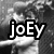 Black-and-white pixelated image with three text overlays: 'joEy', '<3'z', and 'aRzu' on a blurred background.