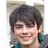 Static 48x48 pixel buddy icon showing a close-up of a person with dark hair and light skin, wearing a teal-colored garment against a blurred background.