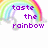 Pixelated rainbow arch spans top with white clouds below, purple text 'taste the rainbow' centered on white background.