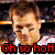Pixelated image of a person with short brown hair and closed eyes, wearing a white shirt against a dark background with red text reading "Oh so hot" at the bottom.