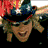Animated contact sheet of seven frames showing a person in various cowboy-themed outfits and poses with text elements including "Big & Rich" and "SAVE A HORSE RIDE A COWBOY".