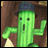 Pixelated green cactus character with black eyes and mouth wearing a dark blue fedora, holding a white object against brown background on left; right side shows pixelated text "Anime IM" above smaller "com" on black background.
