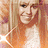 A pixelated image of a person with long light brown hair wearing a white top, next to bright pink background with green text.