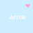 Light blue background with four white 'Annie' text labels arranged in a , accompanied by pink pixelated heart and starburst symbols