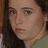 A pixelated image of a person with long brown hair and light skin, positioned next to text reading "a bay bay" above two names labeled "AUDREE <3" and "ALY <3" on black background.