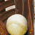 A baseball rests in a brown leather glove on the left, while blue backgrounds display red text with green outlines reading "Catch The Ball" and "BASEBALL".