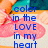 Pixelated image with blue text reading 'color in the LOVE in my heart' over a pink cloud-like shape and multicolored background.