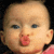 A 2x2 contact sheet of three animated frames showing a baby's face with blue eyes and pink lips, each frame displaying subtle variations in lip position against a black background.