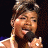 A 48x48 pixel buddy icon featuring a split composition with a person holding a microphone on the left and green text reading "Original Icons .com" on the right against a dark background.