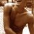 A 4-frame contact sheet of a sepia-toned animated icon showing a shirtless man in various poses with smiling expressions, arranged in a 2x2 grid on a gray transparency background.