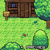 Pixel art scene showing a wooden cabin with blue windows, green grass, trees, and two small colorful objects on the ground.