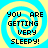 Four identical pixelated display "YOU ARE GETTING VERY SLEEPY!" text over a blue and yellow spiral background