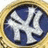 Circular icon with blue and white stylized letters inside a gold border, pixelated rendering.