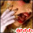 A pixelated image of a person with light brown hair covering their face with both hands, mouth open in a scream, and red text reading 'ahhh' at the bottom.