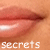 A 3x2 contact sheet of six animated frames showing close-up lips with subtle mouth movements and overlaid text fragments forming "secrets lie on these lips".
