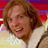 Pixelated static image of a person with brown hair wearing a light-colored shirt against a colorful gradient background.