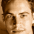 Static 48x48 pixel icon showing a close-up of a person's face with brown hair and light skin tone, rendered in low-resolution pixel art style.