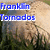 A pixelated image of a large, light brown, rounded object with grassy background and blue text overlays changing across frames.