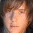 Pixelated portrait of a person with light brown hair against black background, red text 'LOVE DANNY!!!' below.