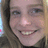 A pixelated image of a person with light brown hair and a smile, set against a blue background with pink text reading "Here's me..." and "Jeanmarie!".