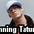 Pixelated image of a person wearing a blue cap and dark jacket with visible text 'ming Tatu' at the bottom.