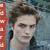 A static image of a person with tousled brown hair wearing a dark jacket over a light shirt against a blurred blue-green background with red vertical icons on the left edge.
