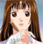 Pixelated image of a person with long brown hair, light skin, and dark eyes, wearing a white top against a light blue background.