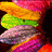 A colorful, pixelated spiral of layered shapes with changing text labels in different colors across frames.