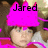 A pixelated image shows a person wearing a bright pink hat with the name 'Jared' in black text above their head, set against a blurred background.