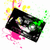 A black cassette tape with silver buttons and a green stripe, surrounded by pink and yellow pixelated splatters on white background.