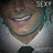 Pixelated close-up of a person with brown hair wearing a white shirt and dark tie, face partially obscured by pixelation.