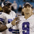 Two pixelated figures in white sports jerseys with blue numbers stand side-by-side against a blurred background, next to text reading "Romo + T.O. aka KI and Scribby" on a solid dark blue field.