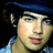 Pixelated image of a person wearing a dark blue cap and light blue checkered shirt with red text reading "I <3 Joe Jonas" on the right side.