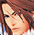 Pixelated close-up of a person with long brown hair, light skin tone, and blue eyes looking slightly downward.