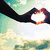 Animated sequence showing hands forming a heart shape against changing backgrounds including sky, clouds, and sunset.