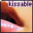 Animated close-up of lips with pinkish skin tone, brown eyebrows, and the word 'kissable' in light purple text above; subtle mouth movement visible across frames.