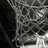 A basketball hoop net and Spalding basketball in grayscale and color views.