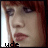 six pixelated showing a person with red hair and dark eye makeup, each displaying slight variations in facial expression and text below