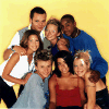 Group of people posing together in various casual outfits against different colored backgrounds.