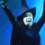 A 2x2 contact sheet of a pixelated animated icon featuring a hooded figure with arms raised against a blue background, paired with green text reading "everyone deserves a chance to" followed by varying letters across frames.