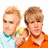Two young men in casual clothing pose together, one with light brown hair and the other with darker brown hair, against a white background.