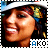 A pixelated image of a person wearing a white headband and colorful patterned fabric, with visible text 'AKO' at the bottom.