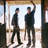 Two men stand in a doorway; one raises his arm while red text reads "Driver picks the music..." and "Shotgun shuts his cakehole."